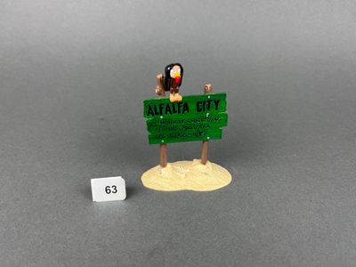 a small figurine of a woman holding a sign