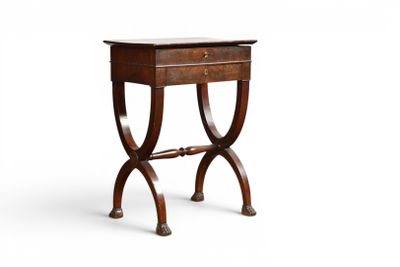 an old wooden table with a drawer on top of it
