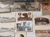 many old photos on a table with a lot of them