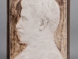 a close up of a plaque of a man in profile