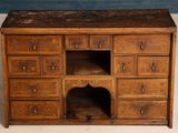 an old wooden cabinet with many drawers and drawers on it