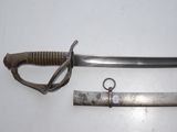 a knife that is laying on a table next to another knife