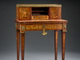 an antique writing desk with a drawer on one side and a drawer on the other