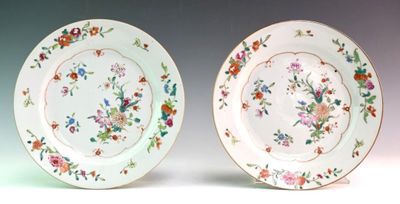 two plates that are decorated with flowers on them