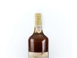 an image of a bottle of wine sitting on top of a white surface
