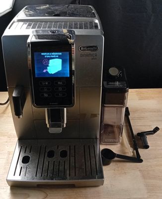 a coffee machine that is sitting on a wooden table