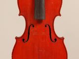 an old violin with a bow hanging from it ' s back