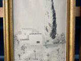 an old picture of a tree in a frame on a wooden shelf