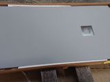 a laptop computer sitting on top of a wooden table