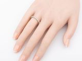 an image of a woman ' s hand with a diamond ring on it
