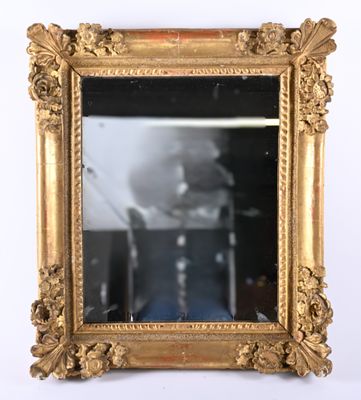 a picture of a gold framed mirror on the wall