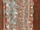 bottles of water are lined up in a box on a table
