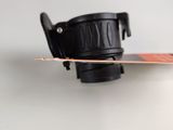 a close up of a snowboard on a white surface with a black strap