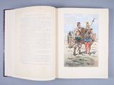 an open book with a picture of a man and a woman on horseback