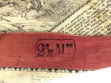 a close up of a book with a red ribbon on it