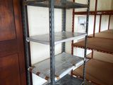 a metal shelf that is in the corner of a room