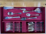 a wooden box with a set of silverware in it