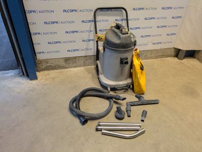 an image of a vacuum is sitting on the floor next to a hose
