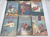 six children ' s books are lined up on a table
