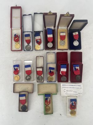 many medals and medals displayed on a white surface