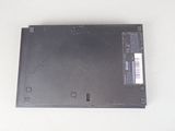 a laptop with a broken battery on a white surface