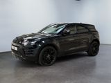 a black range rover parked in a showroom