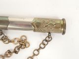 an old brass telescope with a chain attached to it
