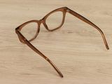 glasses on a wooden table with a white background
