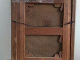 a picture of a picture of a wooden frame on a wall