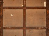 a window in the wall of a building that has been boarded