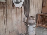 a vacuum that is sitting in the corner of a room