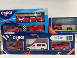three toy firetrucks and a toy car in the box