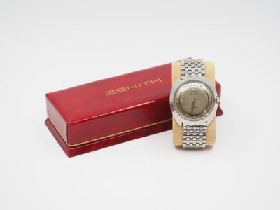 an image of a watch sitting on top of a red box