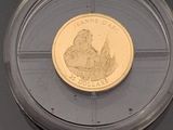 a gold coin with a picture of a woman on it