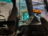 an image of a forklift in a large warehouse