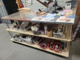 a workbench with a lot of tools on top of it