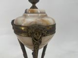 an image of a decorative object on a marble base
