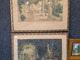 deux tableaux exposés sur une table à côté d'une photo