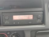 a car dashboard with a digital clock on it