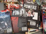 a lot of comic books sitting on a table