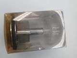 a metal object that is in a box on a table