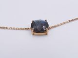 an image of a necklace with a blue stone on a gold chain