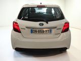 a white car that is parked in a white room