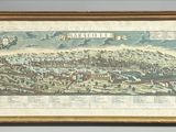 framed map of a city with a mountain in the background