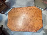 a wooden table with a mirror on top of it