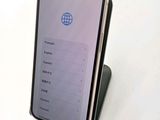 a cell phone that is sitting on top of a stand