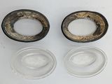 two empty glass bowls sitting on a white surface