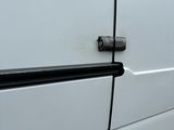 a white van that has a black handle on it