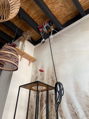 two lamps hanging from the ceiling in a room