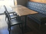 a table and chairs in the corner of a room